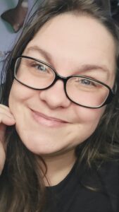 A picture of me on a random day with my hair a mess and smile on my face!